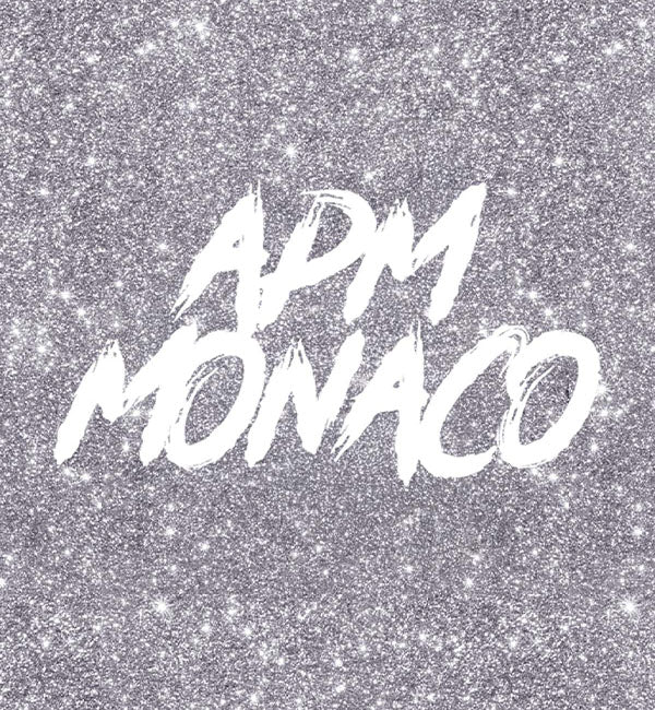 APM Monaco gift card on a glittery silver background